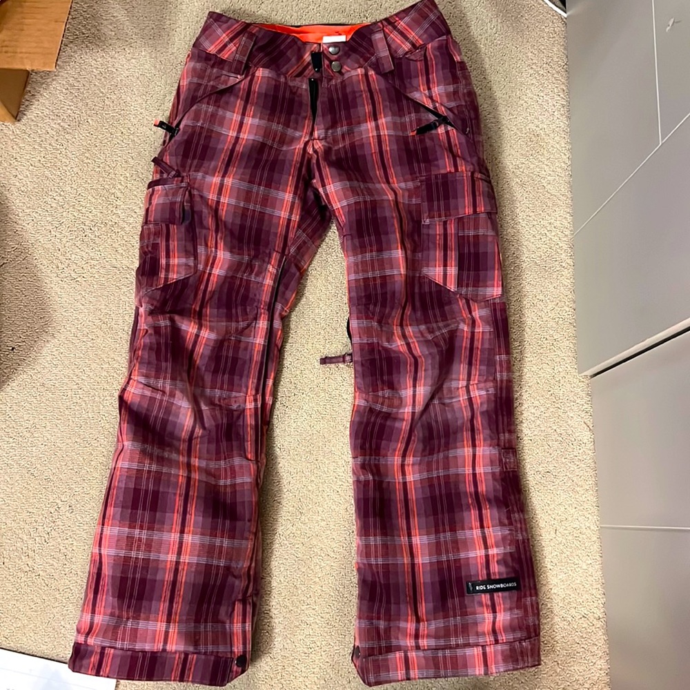 Ride snowboards XS pants in a checkered pink pattern.